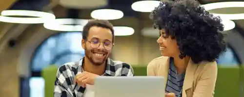 Two people with laptop